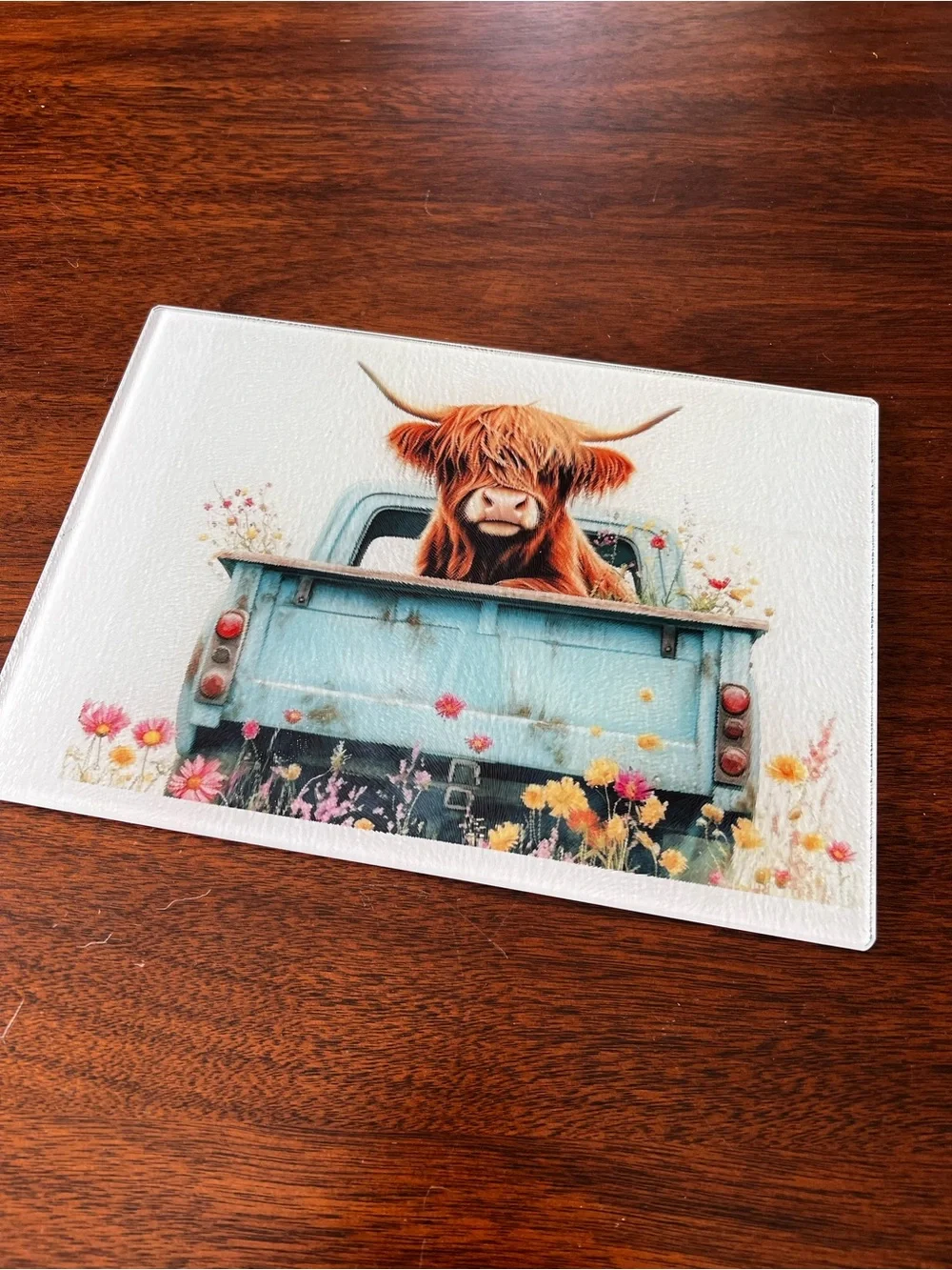 Highland Cow in Vintage Blue Truck glass cutting board